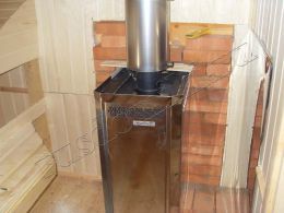 Металлическая печь "Сахара" от фирмы "Теплодар" в парном отделении деревянной бани в Тосно